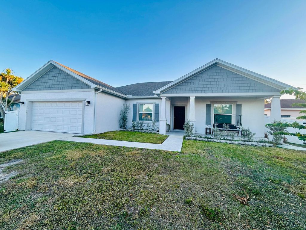 Photo of 1626 SW Neptune Avenue, Port Saint Lucie, FL 34953 (MLS # R11159353)