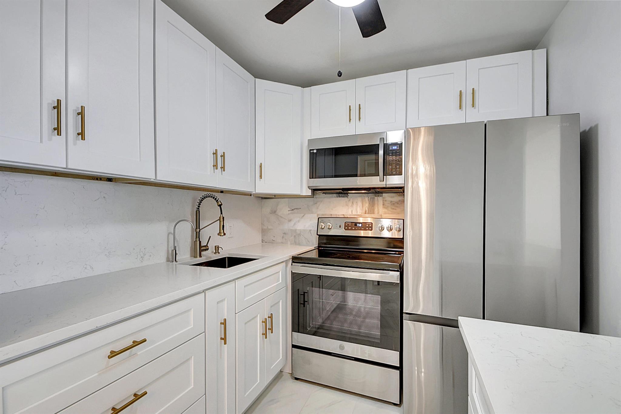 This beautiful recently updated 1 bedroom 1 bath 2nd floor condo is located in an active 55+ gated community called Century Village in West Palm Beach. The Kitchen has white shaker cabinets with quartz tops and stainless steel appliances. Other features included are a pantry / closet located across from the full bath that has a tub/shower combo, new a/c, beautiful marble floors thru out, slider from the master bedroom that leads to a covered and enclosed porch to enjoy relaxing in. Camden N is a nicely maintained building and is located near the pool. Century Village is located near local shopping, restaurants, golf, tennis, boating, fishing, beaches, palm international airport, Kravis center for shows and concerts and so much more