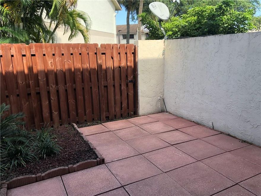 Extremely well kept 2 bedroom, 2.5 bath townhome.  Spacious downstairs is all tiled with sliders leading to private fenced patio area.   Kitchen offers wood cabinets & corian countertops -  light and bright with open counter to LR/DR area. Perfect for entertaining!   The greenhouse window for plants & herbs.    First floor - all ceilings done smooth finish. Both bedrooms have vaulted ceilings and offer private baths as well as walk in closets.  Main bedroom also has 2nd closet. - W/D upstairs  All new baseboards -Freshly painted. Brand new carpet up & on stairs.  AC about 8 years old and HWH 1 year old. Spectacular unit! One pet up to 50 lbs.  Sold AS IS with Right to Inspect