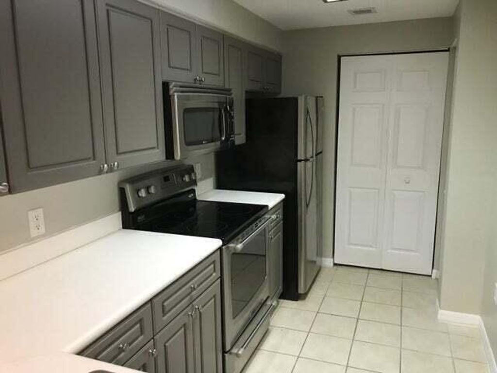 Photo of 3023 Alcazar Place #202, Palm Beach Gardens, FL 33410 (MLS # B26026758)