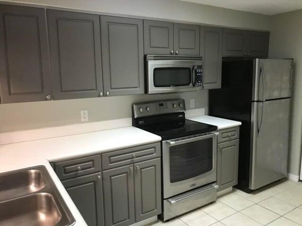 Photo of 3023 Alcazar Place #202, Palm Beach Gardens, FL 33410 (MLS # B26026758)