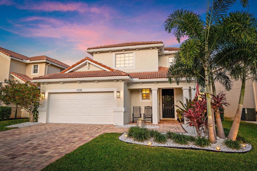 Spectacular four-bedroom, three-and-a-half-bath lakefront home in The Oaks of Hobe Sound featuring the highly desirable Catalina model with soaring ceilings, abundant natural light, and an open-concept design. From the moment you enter, the home delivers a strong first impression with its pristine condition and spacious layout. Luxury vinyl flooring flows through the first floor. The family room connects seamlessly to the kitchen, which includes 42-inch wood cabinetry, granite countertops, double ovens, a large cook's island, and newer appliances (2023), making it ideal for both daily living and entertaining. Pocket sliding glass doors lead to a covered lanai with tranquil lake views, creating a seamless indoor-outdoor lifestyle. The oversized first-floor primary suite features walk-in closets, dual vanities, a Roman tub, a separate shower, and room-darkening shades for added comfort. Sliders from the primary lead out to your lanai and fenced backyard. 
Practical features include a first-floor laundry room with sink, abundant closets, and an under-stair pantry with floating shelves for additional storage. Upstairs, you'll find a spacious loft/media room, two bedrooms with a shared bath, and a second private suite.
Major upgrades provide peace of mind and modern convenience, including a newer HVAC system (2023), gutters (2023), stainless kitchen appliances (2023), water heater (2021) garage door opener (2023), and new toilets (2024). The exterior was freshly painted in 2025. Additional enhancements include plantation shutters on all windows, smart switches and outlets throughout, epoxy-coated garage floors, and extensive overhead storage racks. The fully fenced backyard provides space for a pool.

The Oaks of Hobe Sound is a sought-after gated community known for its low HOA fees. Residents enjoy included services such as basic cable, Wi-Fi, and full lawn maintenance, along with access to a resort-style pool and spa, playground, and secure gated entrances.
Ideally positioned in the center of Hobe Sound, the neighborhood is just minutes from the beaches of Jupiter Island and Jimmy Graham Park, which offers convenient boat and kayak launches. Outdoor enthusiasts will appreciate nearby Gomez Preserve with its popular biking and hiking trails, plus quick access to downtown Hobe Sound's boutique shopping and dining scene.  The newly constructed Hobe Sound tennis center offers pickleball and tennis, less than a mile from the Oaks.