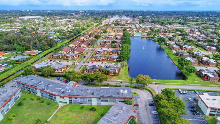 Beautifully updated 2-bed, 1.5-bath condo in an active 55+ community. Tile flooring throughout, designer fans, and recessed kitchen lighting create a bright, welcoming feel. Both bedrooms feature custom electric blinds and sliding glass doors leading to a screened balcony. The primary suite offers a spacious walk-in closet by Closets by Design, with a second custom closet for added storage. Updated bathrooms include a modern walk-in shower, and the kitchen has a brand-new stove. Move-in ready and designed for easy Florida living! A/C 2023