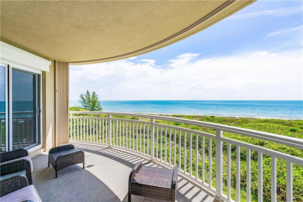 Your new morning routine-watch the sunrise over an endless turquoise ocean from your expansive covered balcony. Life truly is better w/the ocean as your backyard! Inside elevated beach style shines w/tropical colors, elegant wainscoting, & crown molding. Well-appointed kitchen is perfect for entertaining w/granite counters, lrg pantry, breakfast bar. Unwind in the master ste, a sanctuary w/dual vanities & relaxing tub. Enjoy amenities galore-pool, spa, fitness, billiards, private beach access. Convenience is key w/in-unit laundry & under building parking. Miles of riverfront trails across A1A