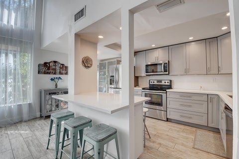 Photo of 6595 Parkview Drive #A, Boca Raton, FL 33433 (MLS # B26019192)
