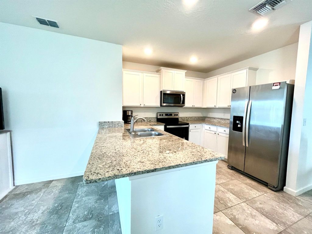 Photo of 10958 SW Robbia Way, Port Saint Lucie, FL 34987 (MLS # R11045075)