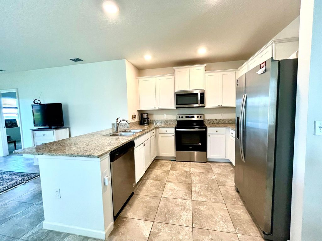 Photo of 10958 SW Robbia Way, Port Saint Lucie, FL 34987 (MLS # R11045075)