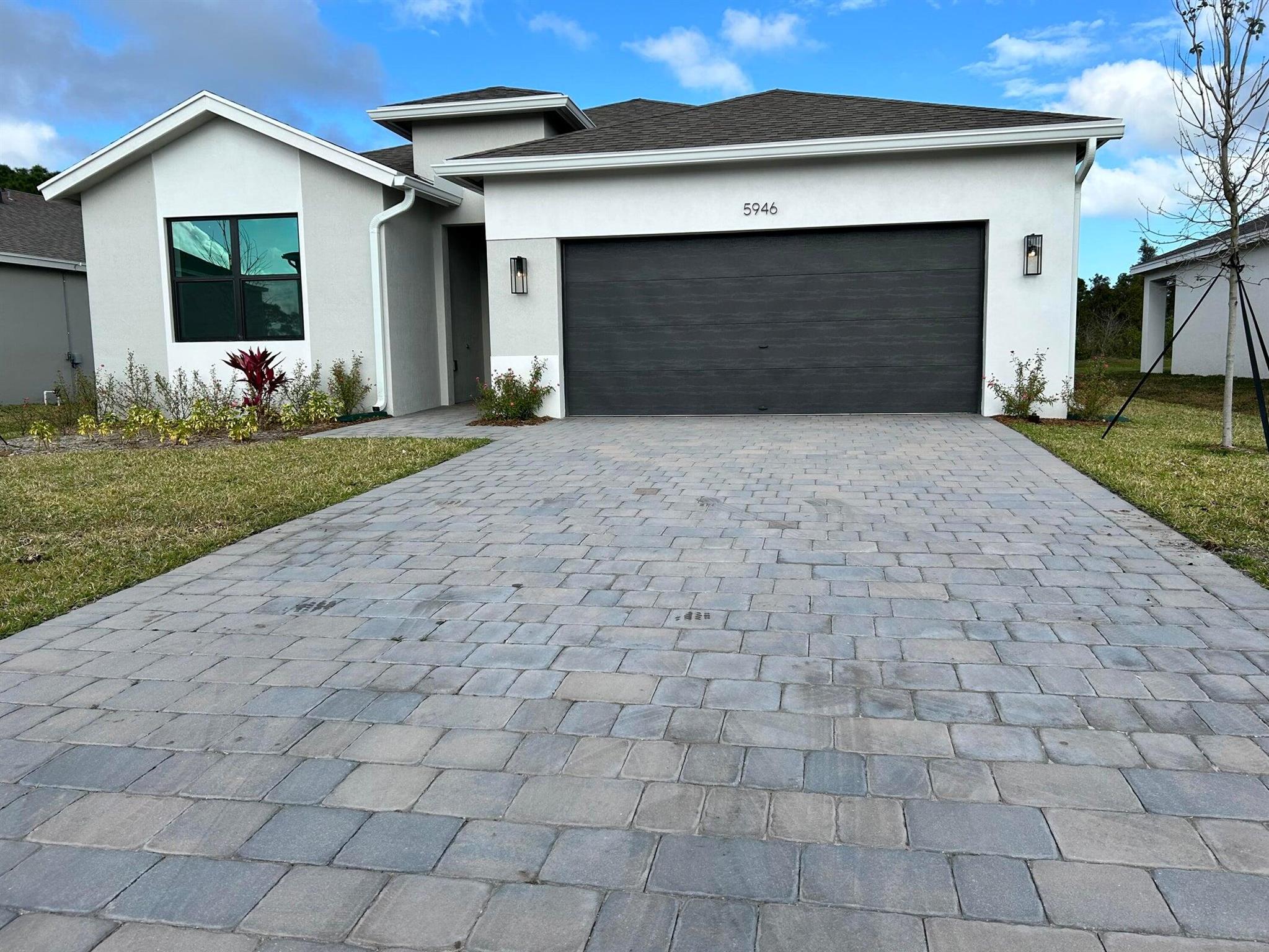 Welcome to 5946 SE Skyblue Circle, located in the sought-after Willow Pointe community of Stuart! This beautiful 4-bedroom, 2-bathroom single-family home, built in 2023, offers 2,033 sq. ft. of modern living space designed for comfort and style. Step inside to an open-concept floor plan featuring a spacious island, pantry, and stainless steel appliances--perfect for cooking and entertaining. The master suite provides a private retreat, complete with dual sinks, a walk-in closet, and a separate shower. Enjoy Florida living with a fenced yard, a big backyard, a covered patio, and access to the community pool and cabana. This pet-friendly rental welcomes up to 2 pets (under 50 lbs.).Conveniently located near I-95 and a few mins. to downtown Stuart and beautiful beaches. Available 11/5/25.
