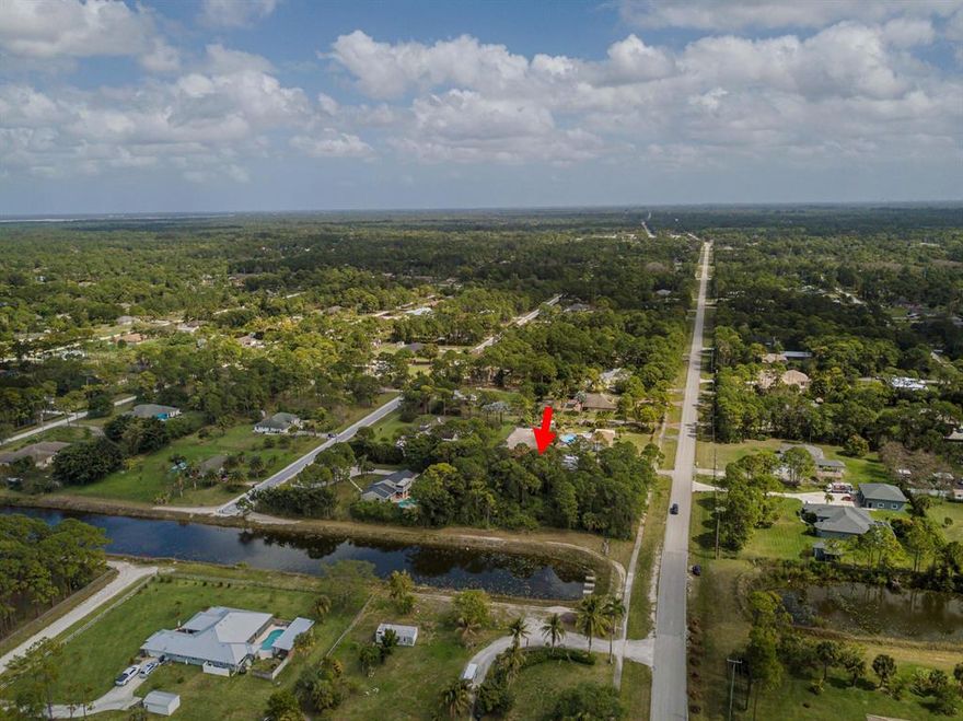 PAVED ROAD   NEXT TO CANAL ON 1.54 ACRES 
CLOSE TO SHOPPING  LOCATED ON  ORANGE BLVD WEST OF SEMINOLE PRATT WHITNEY. 

GREAT  LOCATION WITH BEAUTIFUL HOMES  ON THE STREET.  PERFECT TO BUILD YOUR DREAM HOME.
