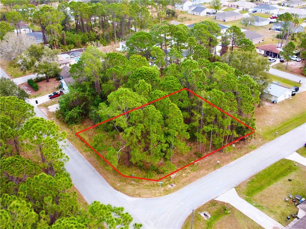 Looking for the perfect spot to build your dream home? Look no further! This corner lot features just over a quarter acre of land. Conveniently located just minutes from schools, shopping, I-95, and the beach. This property offers the best of both worlds - a quiet, peaceful setting with easy access to all the amenities you need. Don't miss out on this incredible opportunity to own your own piece of paradise!