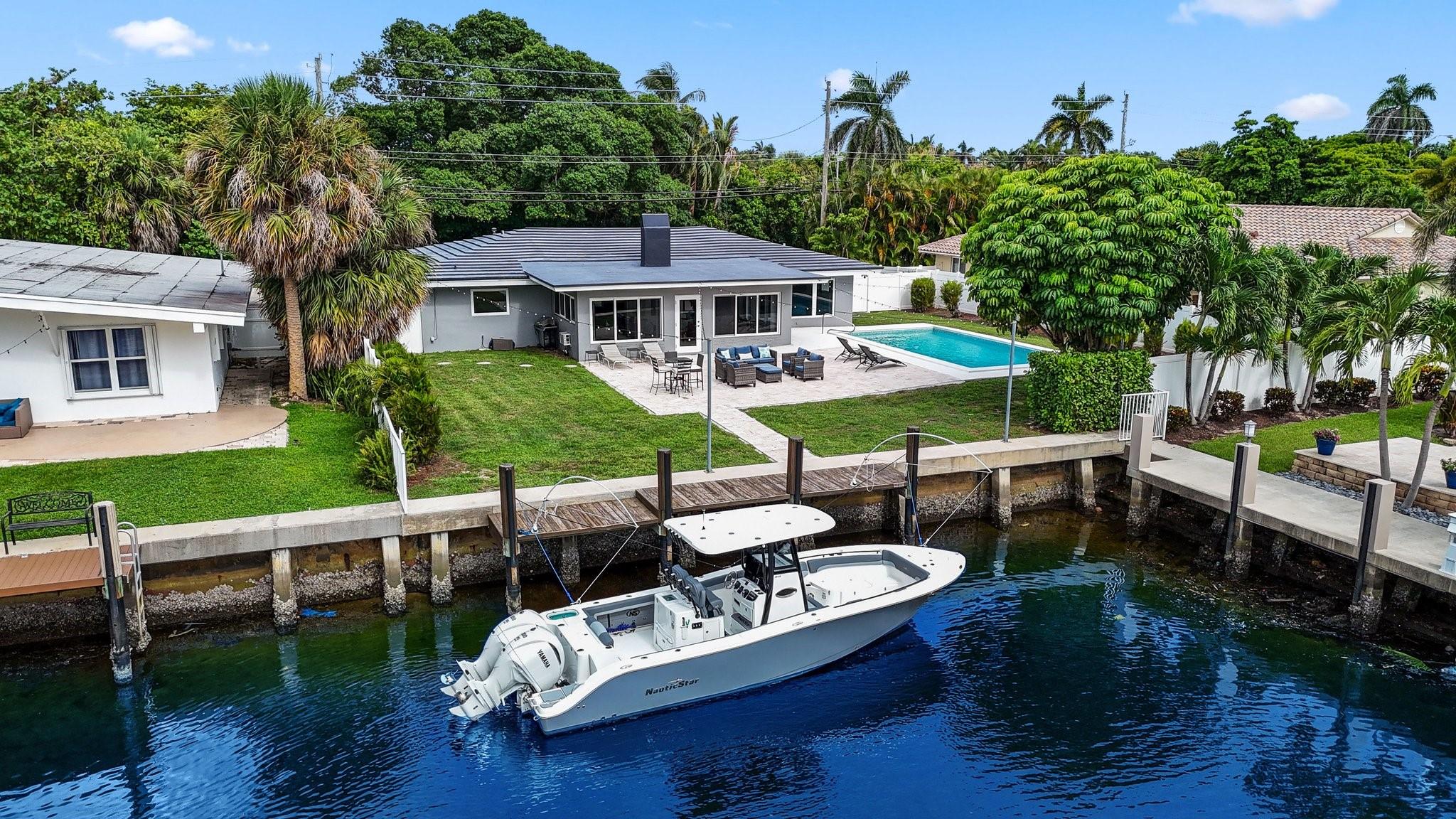 Unbeatable waterfront opportunity in prime Pompano Beach location! Discover one of the best waterfront values east of the Intracoastal a rare chance for developers or dream-home seekers to own a single family residence with direct ocean access and no fixed bridges. Nestled at the end of a quiet cul-de-sac canal, this boater’s paradise is just 5 minutes from the iconic Hillsboro Inlet and moments from optional private beach access. Enjoy spectacular sunset views, watch yachts cruise by on the Intracoastal, and embrace the ultimate coastal lifestyle. Located in one of Pompano Beach’s most desirable neighborhoods, this property offers a perfect blend of location, luxury, and limitless potential.