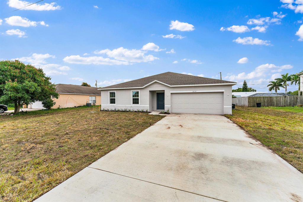 Photo of 2674 SE Walton Road, Port Saint Lucie, FL 34952 (MLS # R10966412)