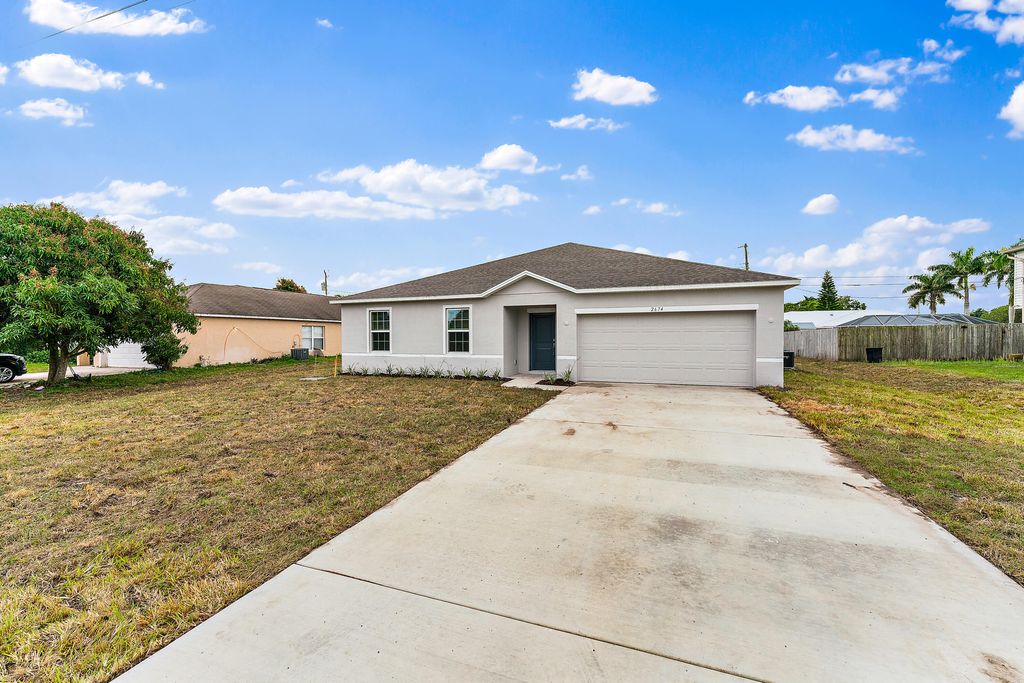 Photo of 2674 SE Walton Road, Port Saint Lucie, FL 34952 (MLS # R10966412)