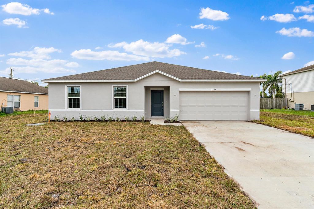 Photo of 2674 SE Walton Road, Port Saint Lucie, FL 34952 (MLS # R10966412)