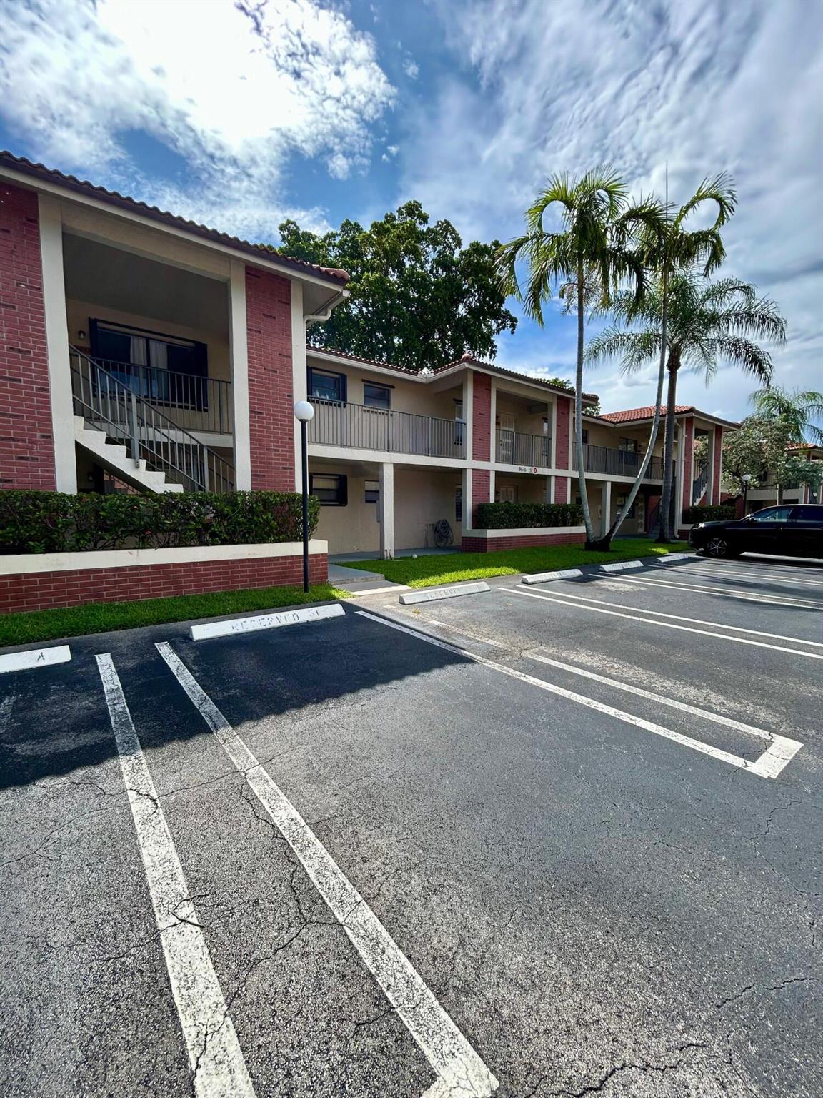 Recently renovated 2-bedroom, 2-bath condo in a prime Coral Springs location! This 870 sq ft unit features a modern kitchen, in-unit washer and dryer, window shutters, and a spacious screened-in balcony. Enjoy access to the community pool and the convenience of two assigned parking spaces. Located just steps from J.P. Taravella High School and Coral Square Mall, with shopping, dining, and entertainment all within walking distance. Small pets allowed (one pet under 20 lbs). Immediate move-in available, subject to association approval. Don't miss out on this rare rental opportunity!