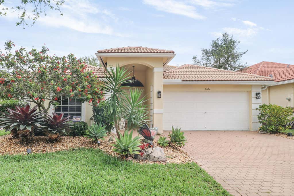 Photo of 5671 S FOUNTAINS Drive S, Lake Worth, FL 33467 (MLS # B26064810)