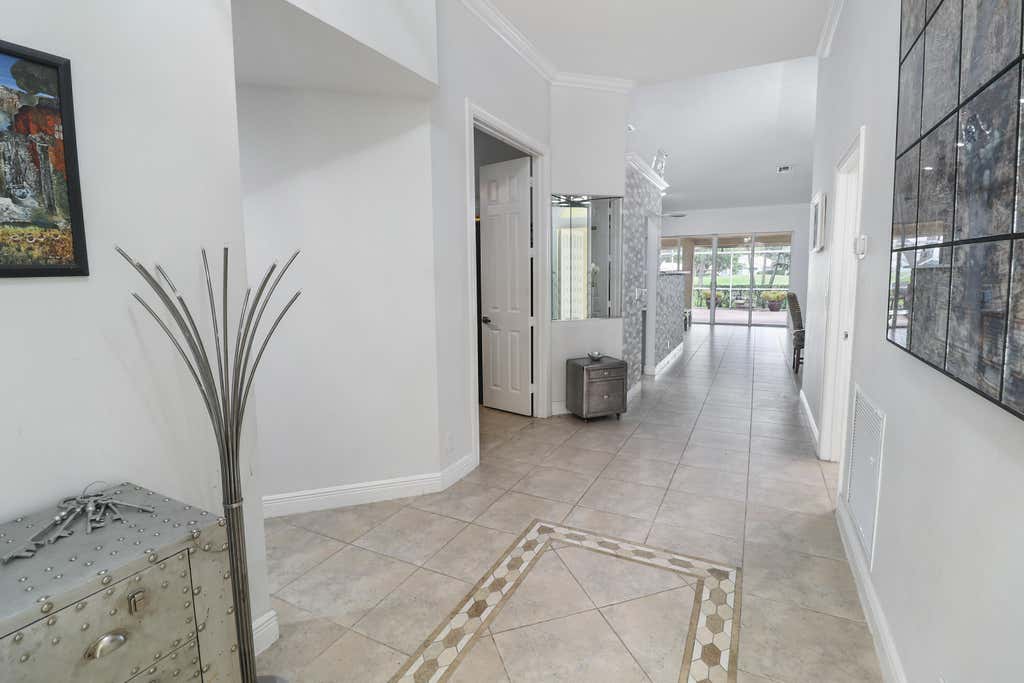 Photo of 5671 S FOUNTAINS Drive S, Lake Worth, FL 33467 (MLS # B26064810)