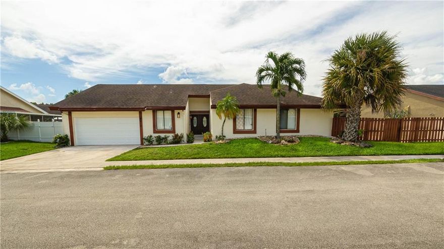 Spacious 4 bedroom 3 bathroom home in West Tamarac with an inviting open floor plan. This home is newly renovated and details updated kitchen, bathroom, new flooring, and air-conditioned garage a bonus! This home is pristinely kept and boasts a spectacular swimming pool.  This gem won't last long. Move-in ready for a new family.  Quick closing available. Schedule your showing today!