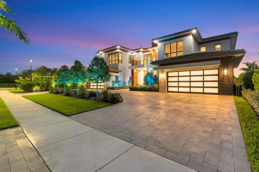 Price improvement on one of the most luxurious properties in Boca Bridges. This is your opportunity to step into the lap of luxury at an even more enticing value. Ultra contemporary breathtaking, modified, extended &highly upgraded Palazzo model (over $1m in enhancements). 1 of just 3 contemporary Palazzo's in this esteemed community. 7769 living sq ft & a total of 10,000 sq ft. Situated on a spacious waterfront private lot (.37 acre) with only one neighbor makes for enhanced privacy when entertaining. Attention to detail is noticeable from the bespoke appointments throughout the residence. Golfer? Enjoy the private golf simulator located in the game room & putting green outside.  Entertain your guests in the fabulous bar and game room.  Wine connoisseur? Check out the wine rm!