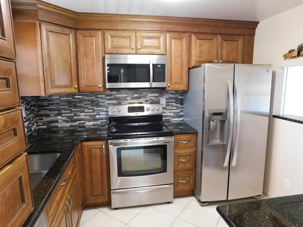 Photo of 9580 Sunrise Lakes Blvd #202, Sunrise, FL 33322 (MLS # F10531109)