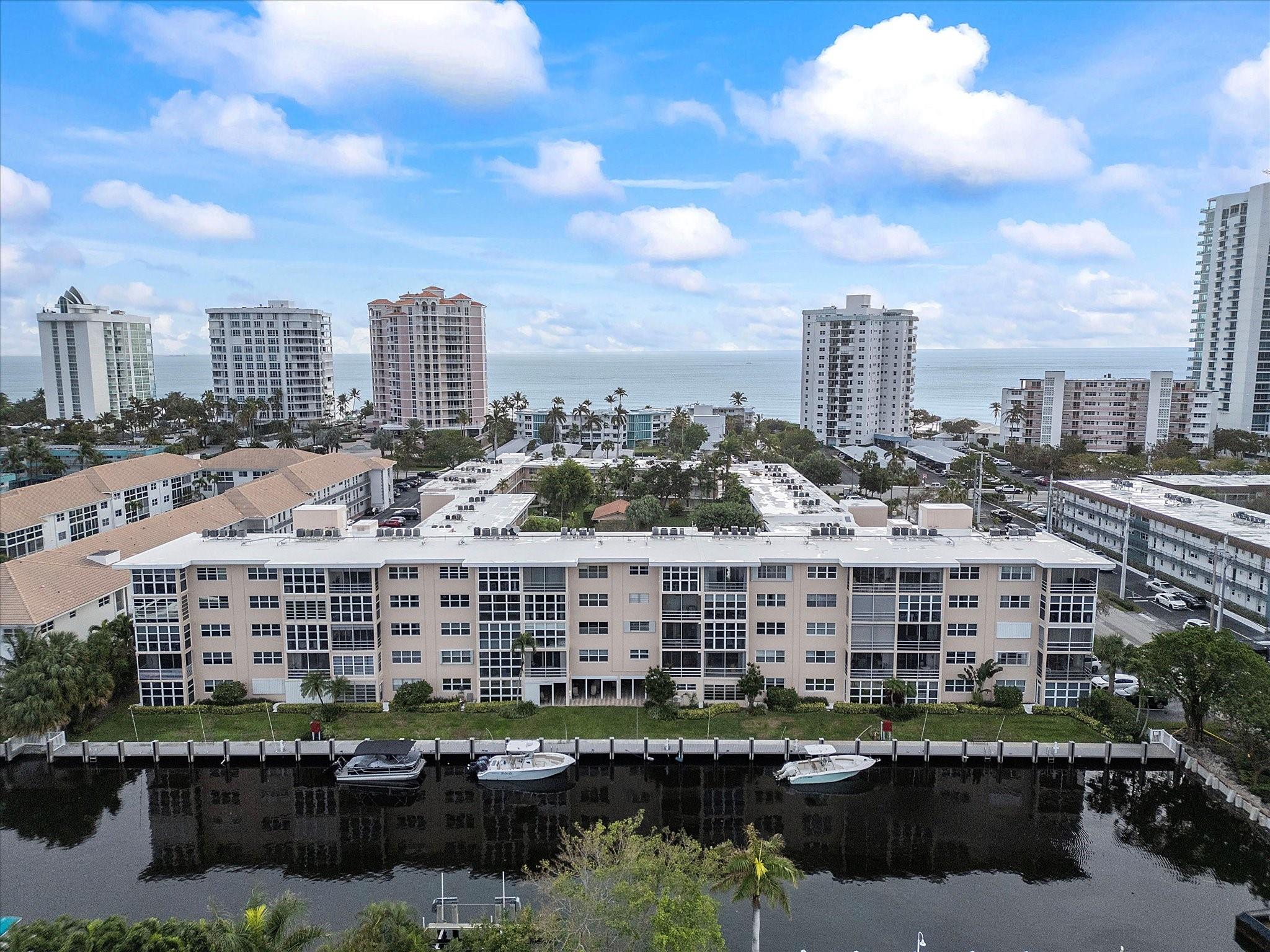 This updated, all-ages furnished 2-bedroom, 1.5-bathroom unit offers a charming water view, creating a serene setting for everyday living. The modern interior features granite countertops, impact windows for added safety and efficiency, AC unit and water heater are less than 6 years old. Boating enthusiasts will appreciate the boater's dream setup with boat docks available for 30-32 ft boats. The community enhances the coastal lifestyle with a gated beach access just across the street, providing a convenient and private way to enjoy the shoreline. Residents can also take advantage of the community amenities, including a pool, putting green, and shuffleboard, making this property a well-rounded haven for relaxation and recreation.
