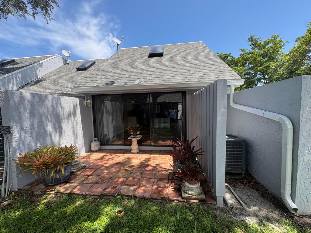 Photo of 25 DEER CREEK Road #C101, Deerfield Beach, FL 33442 (MLS # B26074081)