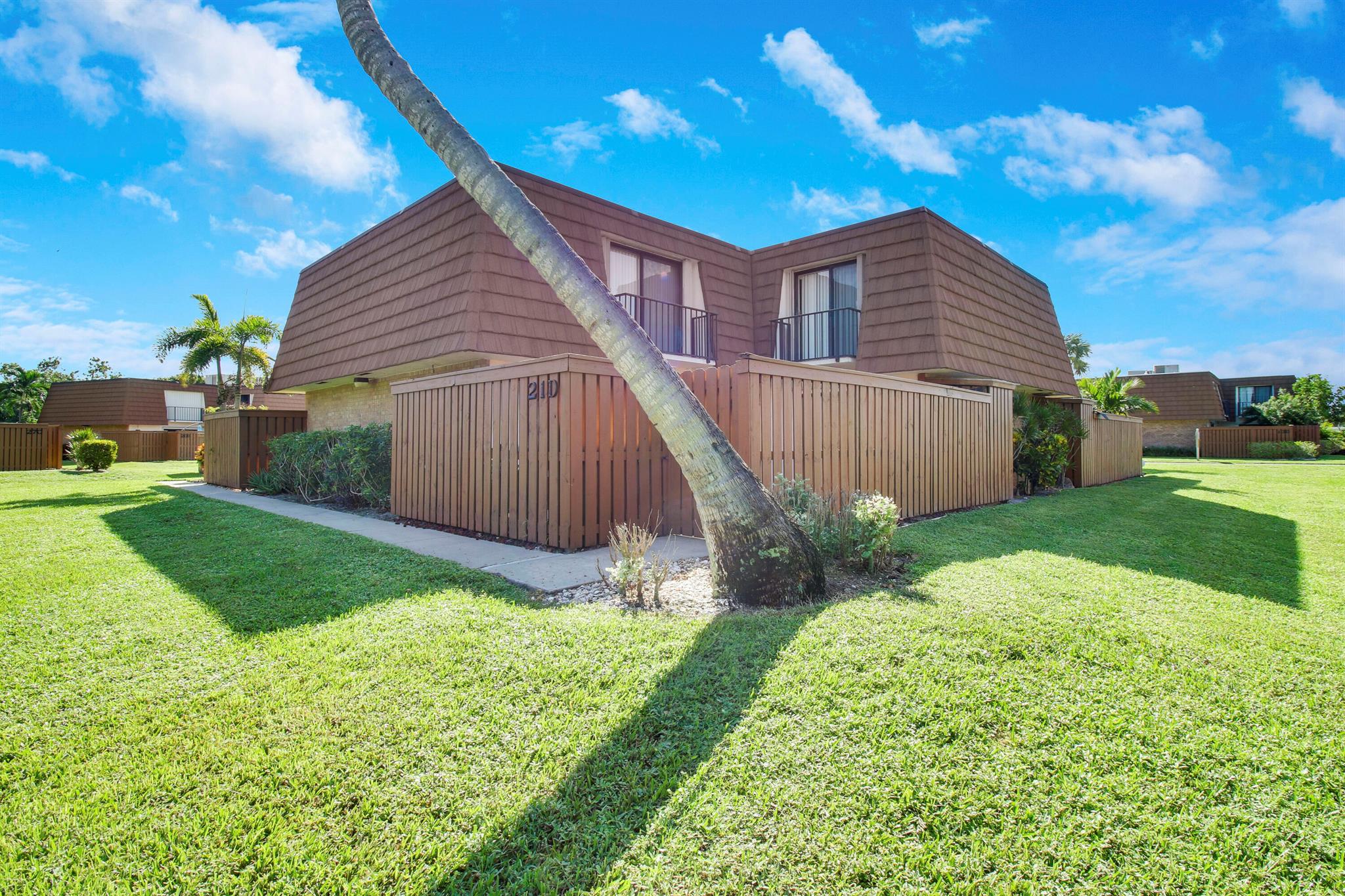 Welcome home to this cozy 2bed/2.5bath townhouse in the Tequesta Hills community. This unit is light and bright, clean, and ready for new owners!! Currently rented till April 2026. Newer roof. Tile throughout the downstairs living areas, huge living room, updated kitchen with new stainless-steel appliances. A half bath with a full size washer and dryer off the dining area. LVP flooring up the stairs and into both upstairs bedrooms. Walk in closets, and stand up shower in the master. Both bedrooms have slider doors with open air balconies. This unit is perfect for entertaining and guests with your very own private, fenced in courtyard/patio area! Located close to the pool and just minutes to the park. Accordion shutters complete. 2 assigned parking spaces. Investors welcome! Dont miss