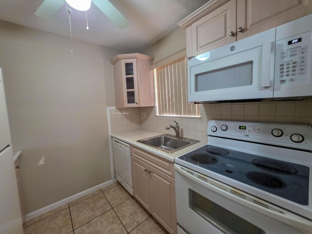 Photo of 6080 Forest Hill Boulevard #103, West Palm Beach, FL 33415 (MLS # B26003310)