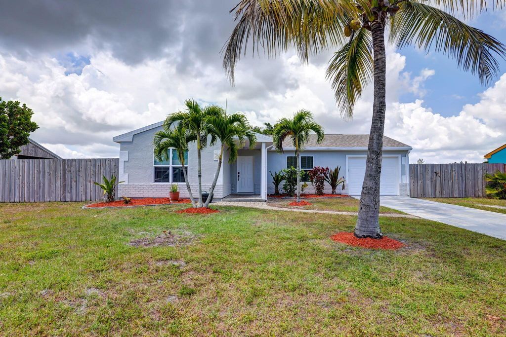 Photo of 2050 SE Triumph Road, Port Saint Lucie, FL 34952 (MLS # R10984072)