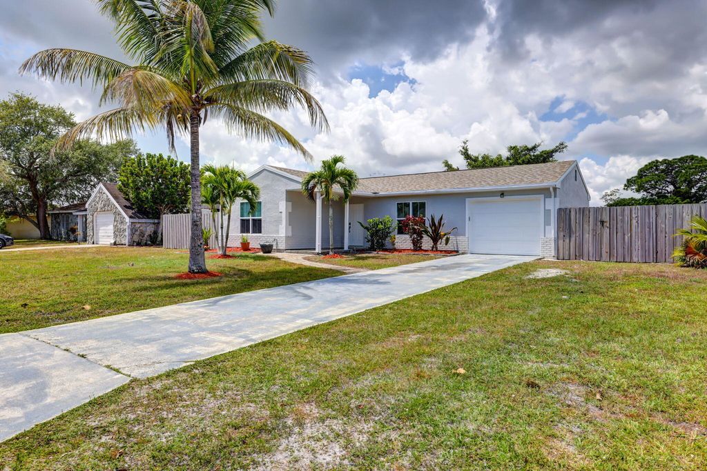 Photo of 2050 SE Triumph Road, Port Saint Lucie, FL 34952 (MLS # R10984072)