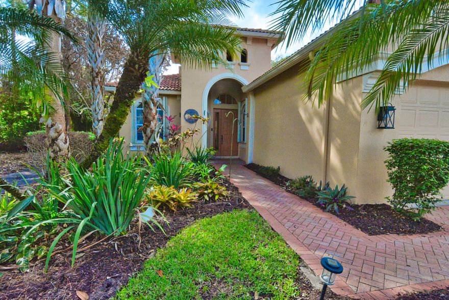 Stunning, absolutely flawless home in the exclusive gated community of PGA Village! This beautifully upgraded 3-bedroom, 2-bath residence backs to a serene preserve, delivering privacy and peaceful views from your oversized screened lanai oasis. Step inside to fresh paint, new stainless steel appliances, diagonal Saltillo tile flooring, crown molding, soaring ceilings, and elegant 8-ft doors. Upgrades include custom backsplash with cabinet lighting, custom laundry cabinetry, etched rear slider, and accordion shutters. HOA covers lawn care, security, cable, internet, and Island Club amenities. PGA Village is the perfect place to enjoy world-class golf, premier shopping, fine dining, and everything the Treasure Coast has to offer! LIVE LIKE A CHAMPION!