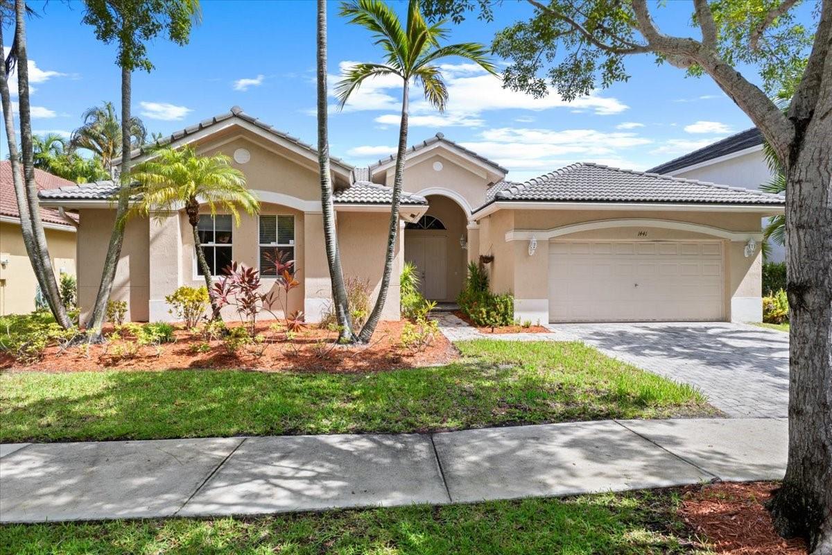 Discover this large, one-story home featuring 4 bedrooms and 3 bathrooms in the prestigious gated community of Savanna Weston. Step inside to find porcelain tiles throughout the main areas and laminate flooring in the bedrooms, plus high ceilings and elegant crown molding that add to the home’s inviting atmosphere. The open gourmet kitchen boasts granite countertops and newer stainless steel appliances, while the huge master suite offers walk-in closets and a generous master bathroom. Outside, enjoy pavers on the driveway with plenty of parking, a screened porch, and access to fantastic community amenities including a pool, gym, playground, tennis and basketball courts, all within a secure, gated community with a guarded entrance. A+ school zone!!