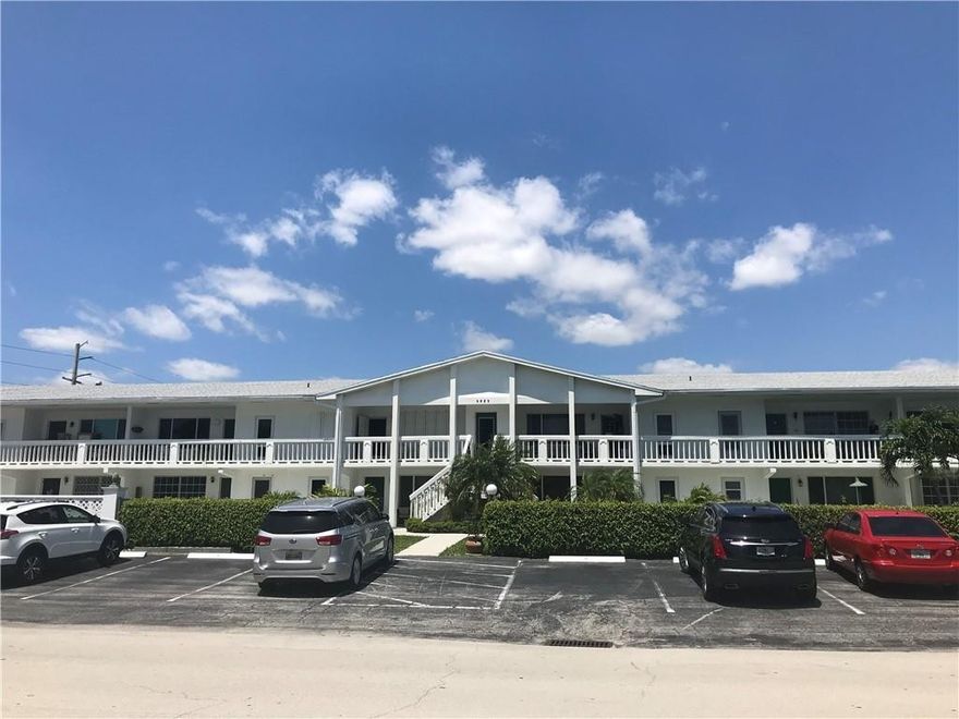 Very well priced second floor apartment  in a boutique 55+ community with heated pool. Light and bright unit with outside patio. Impact windows in bedrooms. New roof for building installed 2019. Building has completed its 40/50 year inspection. New railings, concrete restoration and building painted in the last year. Quaint and quiet garden apartment with front patio overlooking the pool.1/2 mile to Publix, CVS, restaurants and bars. Very short distance to medical clinic and Imperial Point Hospital. This desirable location near US1 makes it easy to navigate without a car if so desired! Common area laundry. No pets & no leasing for two years. Total maintenance & land lease payments are $525.00 monthly. Interior pics to be loaded shortly. No building windstorm insurance coverage or reserves