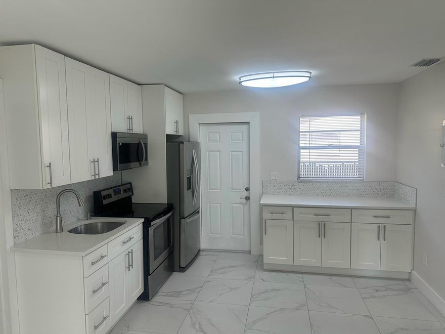 Newly renovated 2 bedroom 2 bathroom in desirable Ft. Lauderdale area.  Unit features modernized interior with high end finishes throughout.  Just minutes away from the beach and downtown Fort Lauderdale.  Easy access to local amenities, cafes, restaurants and parks.  Large backyard for unwinding after a long day.  Unit is priced to go fast so bring your most qualified clients for a showing. Don't miss out.  No HOA approval required so quick and easy move-in.