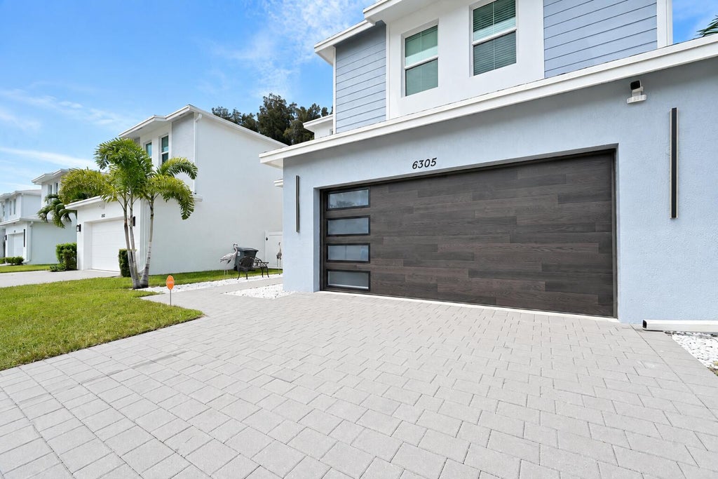 Photo of 6305 TENOR Drive, West Palm Beach, FL 33413 (MLS # B26063780)