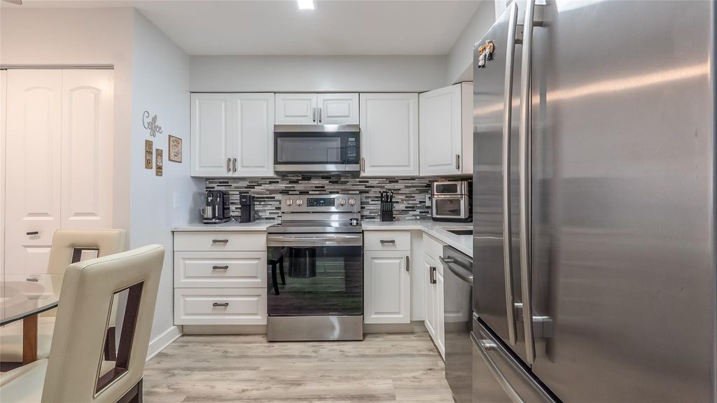 Photo of 4550 NW 18th Ave #604, Deerfield Beach, FL 33064 (MLS # F10532943)