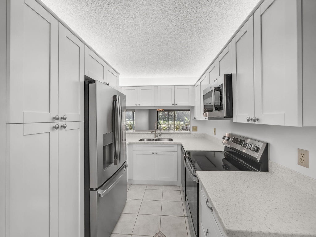 Photo of 1101 Keystone Drive N #F, Jupiter, FL 33458 (MLS # R11117327)