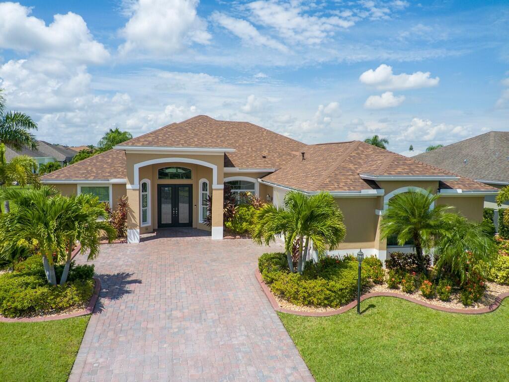 Beautifully maintained 3BR/3BA + Den CBS home featuring a 2025 roof, impact glass throughout, and stunning lake views from nearly every room. Enjoy a spacious floor plan with a large master suite with tray ceiling and crown molding, formal dining, and a family room accented with a gorgeous stone wall. Upgrades include an expansive paver driveway and patio, tile set on the diagonal, and LVP in bedrooms. Kitchen features natural gas cooktop, soft-close drawers, granite, & a large Island. Oversized 2 car garage with epoxy floors and extra storage. Light, bright, and move-in ready!