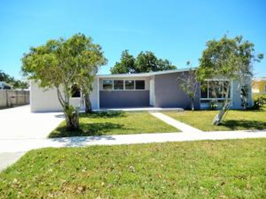 This Magnificent 4 bedroom 3bath CBS Home has over 2,200 sq ft of living space. It's been completely upgraded and ready to move in.New roof put in 2015.Freshly Painted inside and out. New windows and sliding doors installed throughout home. Wood tiles in the bedrooms with tall baseboards throughout.Bathrooms have been nicely updated.New elegant kitchen with NEW Modern Cabinets, granite, backsplash and NEW Frigidaire stainless steel appliances.Sit on your tranquil tropical backyard and enjoy swimming in your private pool.Conveniently located.This home has everything you need and is a must see today.You will not be disappointed.PRICED FOR A QUICK SALE.