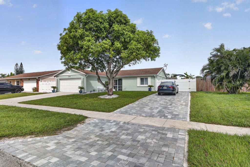 Photo of 10145 Penzance Lane, Royal Palm Beach, FL 33411 (MLS # B26089528)