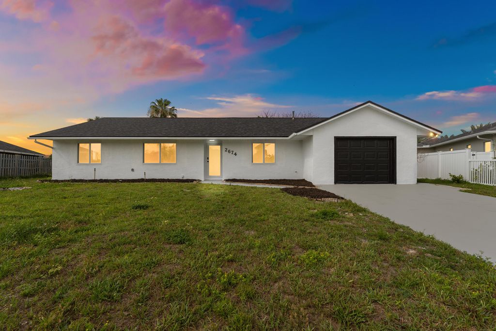 Photo of 2674 SW Monterrey Lane, Port Saint Lucie, FL 34953 (MLS # B26030484)
