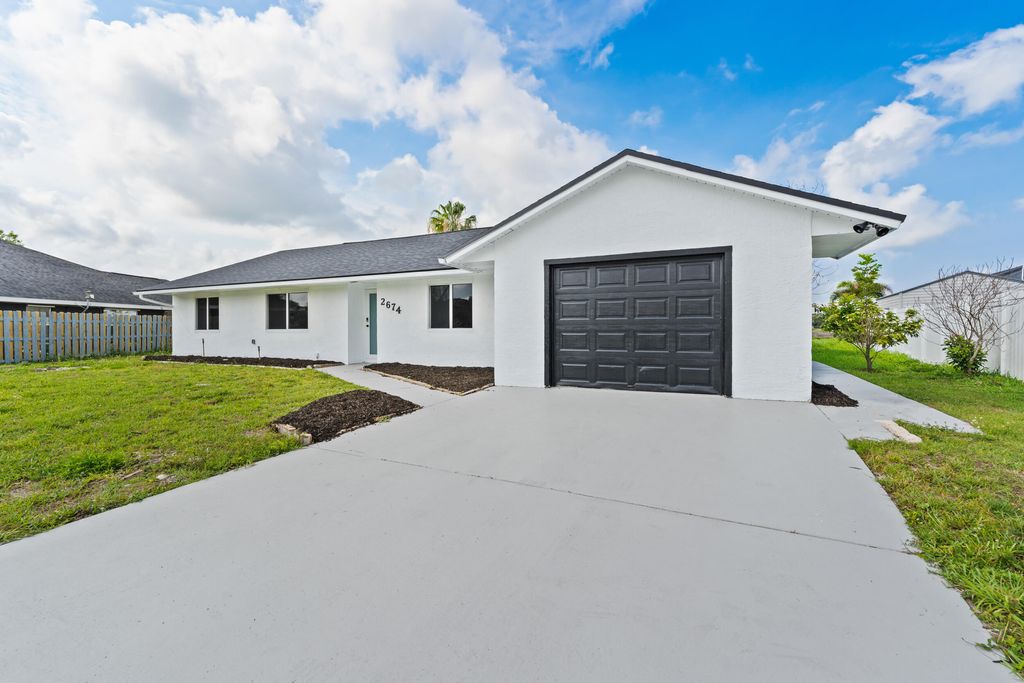 Photo of 2674 SW Monterrey Lane, Port Saint Lucie, FL 34953 (MLS # B26030484)