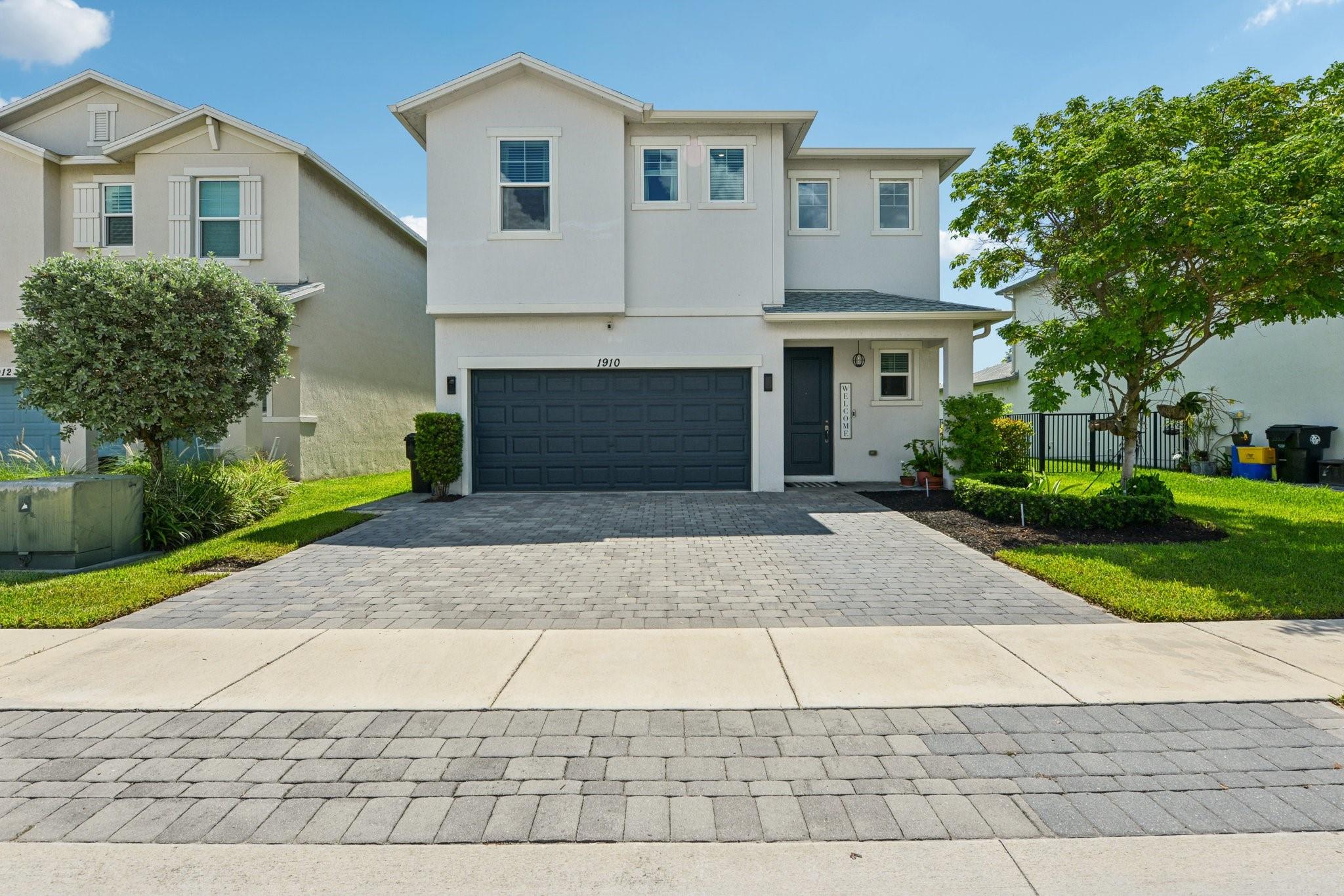 Welcome to this stunning 4-bedroom, 2.5-bath smart home with a 2-car garage, built in 2019 and loaded with upgrades. Enjoy granite countertops, vinyl floors, and smart LG appliances. This home is equipped with a smart thermostat, Ring doorbell, camera system, smart door lock, smart garage, and smart patio and porch lighting. Solar panels add energy efficiency, while impact windows and doors offer security and peace of mind. The spacious laundry room includes a smart washer and dryer. The master bedroom is conveniently located on the first floor, and the home boasts a large pantry, open-concept living space, and serene lake views. Perfect for modern living with technology, style, and comfort in mind. Don’t miss this incredible opportunity!