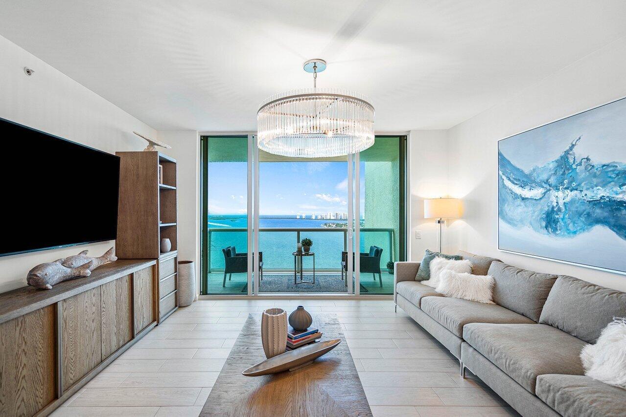 COMPLETELY REMODELED in 2021 - EXQUISITELY FURNISHED! This fabulous 2BR + den (easily converts to 3rd BR) was professionally renovated & elegantly furnished by renown Design Guild Interiors of Jupiter, FL with a sophisticated ''Urban Beach Lifestyle'. The design package includes porcelain plank floors, glass shower enclosures, upgraded vanities, custom kitchen w quartz countertops, custom closets. Available furnished. 3 flat screen TVs. This is Florida Lifestyle at its finest- Newly renovated rooftop oasis w/pool, spa, BBQ areas, tennis, pickleball, bocce. Clubhouse, billiard room & fitness center. 24 hr manned gate, temperature controlled storage, walk to Publix. Marina w/dry docks available. Jump on your boat effortlessly & be on the ocean in minutes; no fixed bridges! Pet friendly.