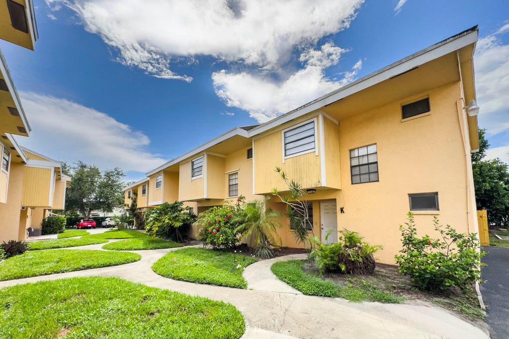 Photo of 4330 Lilac Street #K, Palm Beach Gardens, FL 33410 (MLS # B26076066)