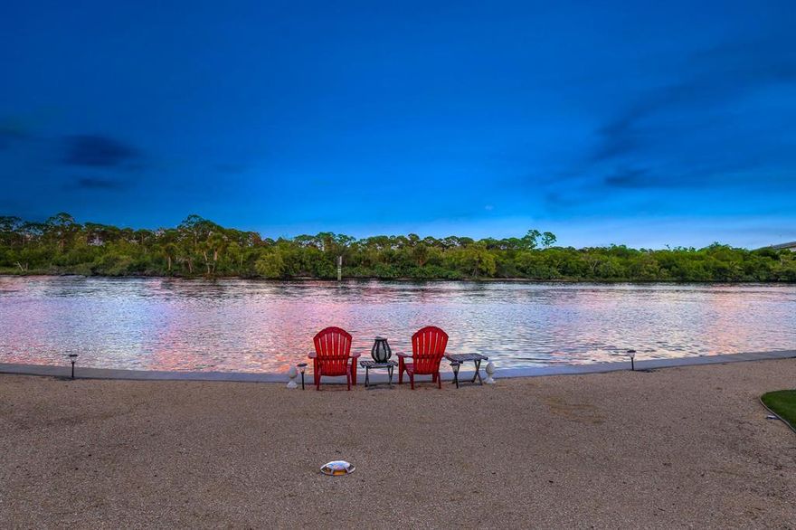 14062 Paradise Point Road is an ultra-private location right in town, 1.5 miles from gorgeous Juno Beach. This is a very unique and very private ''direct intracoastal'' home site with an unobstructed eastern view of the Juno Beach Preserve wooded area.   This ''owner centric'' transitional style home was completed in November of 2013.   

A virtual tour can be viewd at Vimeo by typing the street address on the Vimeo web site.

 'Luxurious master suite accommodations spoil the owners with a panoramic view of the intracoastal waterway and Juno Beach Preserve.  The 10' x 17' ''her'' dressing room in the master suite only complements the unbelievable onyx laden 15' x 25' master bathroom with backlight onyx counter tops. The master suite onyx coffee station allows for a relaxing morning coffee on the master suite balcony to view the sunrise over the Juno Beach PreserveElectric blinds are window treatments are included.  The main entry and formal living room boast 23-foot ceilings.  The second-floor houses both master suites; one for the owners and the other for spacious guest accommodations. The extensive privacy landscaping provides almost total privacy for hot tubbing/swimming or family gatherings. 
This unique property has a beautiful, expansive easterly view of the intracoastal waterway with daily sunrises over nature's tranquil undisturbed backdrop of the Juno Beach Preserve. This spacious homesite creates an outstanding entertainment and viewing experience every day. The property is meticulously landscaped with wandering crushed shell pathways leading to the concrete entry steps to the intracoastal water way.  These steps provide easy entry and exit for paddle boarding, kayaking or just taking a walk on to the sandy beach at low tide. 
The beautiful custom pool with copper water/fire bowls, deck jets complemented with Sonos music throughout the property create an unparalleled entertainment experience.  The artificial putting green located close to the home and pool are an entertainment hit for children and adults at every gathering. 
The driveway and pool decks are tumbled marble that provide an elegant rich look to the property.  Included in the property is a top of the line Hot tub in a private location for your relaxion in private. The hot tub includes LED lighting, blue tooth, speaker and subwoofer to set the mood. 
The 26' composite dock perched on the 142' seawall is ready to accommodate the new owner's boat of choice in the designated "slow speed zone" of the intracoastal waterway. Newly installed boat lift pilings can accommodate approximately a 30-foot boat, or you can dock your larger vessel parallel to the new composite dock platform. Water and 100-amp electric service have been planned for to suit you boat's needs.
Close to the new dock is a fully finished, climate-controlled boat shed to house all your boating accessories in "rust free environment" close to your boat. 
Maintenance free Astroturf cover the north and south yards to eliminate maintenance, providing and always just cut lawn appearance.
3 16 SEER Trane A/C units include a transferable 10-year warranty on parts.  The foam filled walls and insulation installed at construction keep electric bills very low for a home this size.
3 Recently constructed surrounding the property give this street a revitalized and refreshed feel.  

Dual security entry gates secure both driveways with an 8-camera security system. This provides both privacy and security for this property.  Paradise Point Road is a cul-de-sac eliminating through traffic. No HOA and essentially no neighbors once you close your gates......uber private right here in town.

The listing agent is the owner of this property.  The property has been very well maintained and shows "like new". This property is move in ready ...no repairs/maintenece needed to move in.