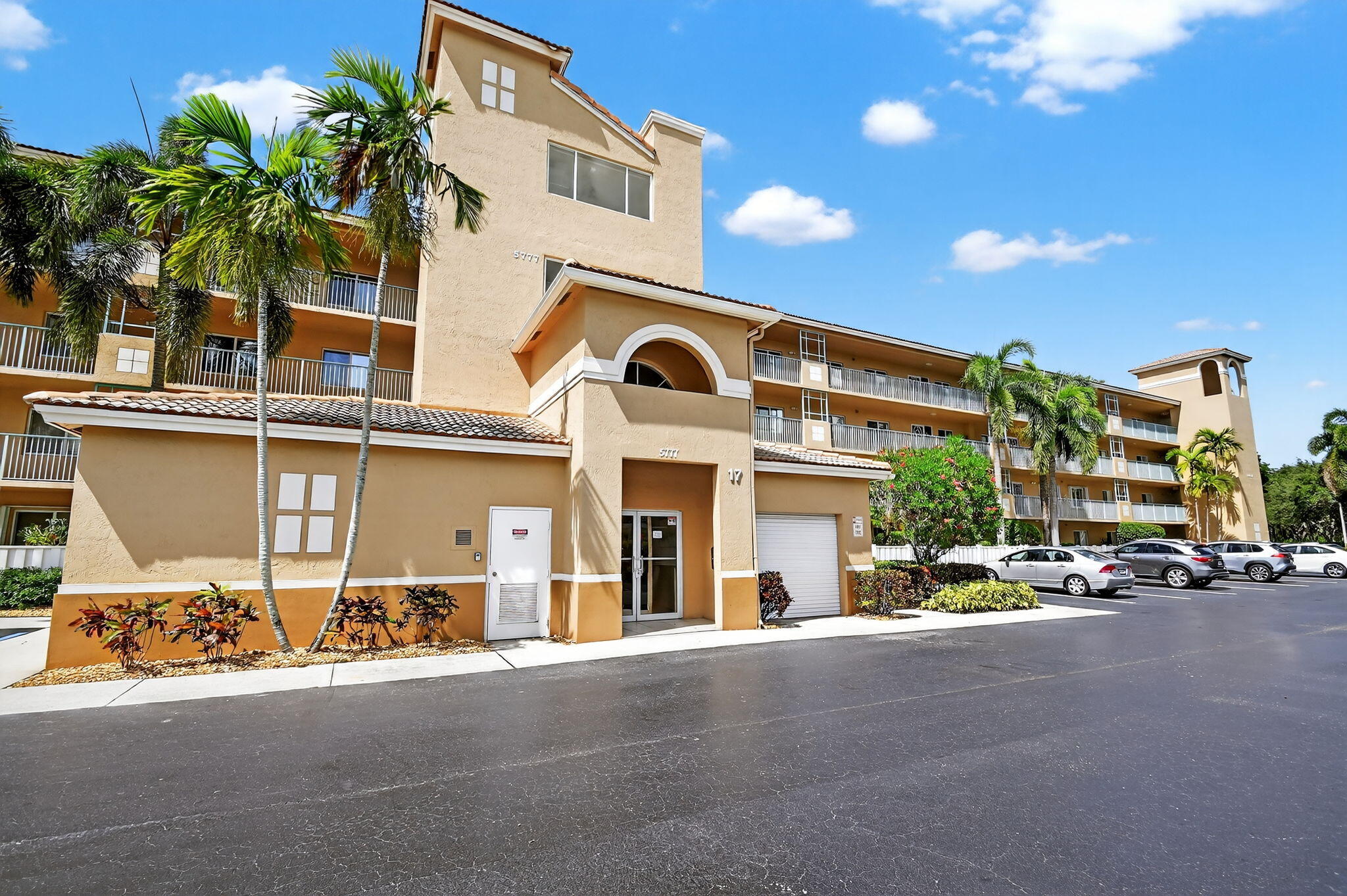Live the Life You Deserve in This Rarely Available Majesty Model at Coral Lakes:Welcome to your slice of paradise in Coral Lakes, one of South Florida's premier 55+ communities. This rarely available Majesty model in Coral Cove offers 1,869 square feet of beautifully remodeled, Penthouse living with breathtaking panoramic lake views.Designed for comfort and style, this two-bedroom plus den, two-bath residence features an enclosed Florida room perfect for morning coffee or sunset relaxation. The spacious primary suite is a true retreat, complete with a walk-in closet and spa-inspired bathroom with dual vanities, a Roman tub, and a separate glass-enclosed shower.Thoughtful upgrades throughout the home include rich wood-look laminate flooring, crown molding, and plantation shutters.