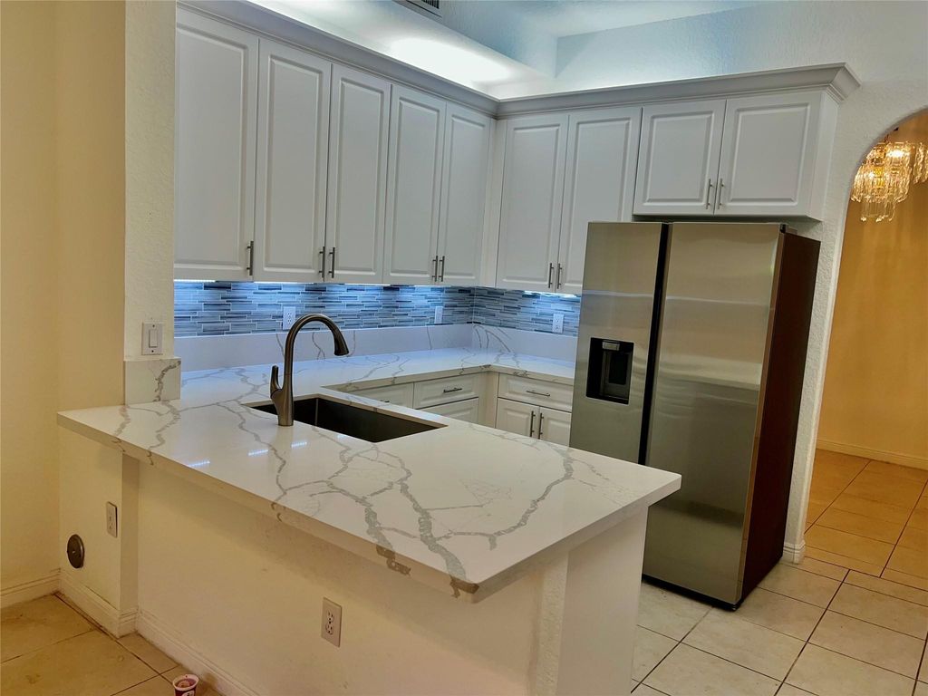 Photo of 7932 Exeter Cir W #7932, Tamarac, FL 33321 (MLS # F10535108)