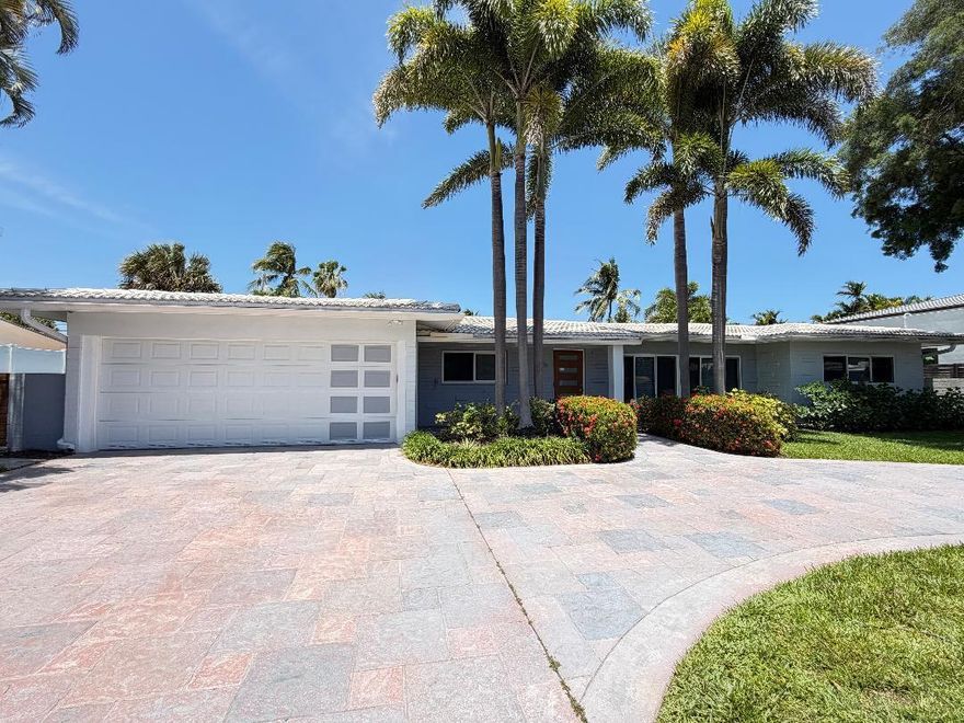Located in the highly desirable Bayview Elementary School District, this beautifully maintained one -story pool home offers 3 bedrooms, 3 bathrooms plus a Den/Convertible bedroom in a thoughtfully designed living space. Its unique U-shaped layout maximizes indoor-outdoor living, with nearly every room enjoying direct access to and views of the private pool. The open-concept living, dining, and kitchen area features vaulted ceilings, architectural lighting on smart dimmers, and impact windows and sliding glass doors throughout..  Step outside to a 36-foot-wide covered lanai overlooking a fully walled lush tropical backyard oasis. The pool has been updated with a brand-new Blue Diamond Brite finish (2024) and includes a premium Gulfstream heater   (most efficient in the industry) ...more for year-round enjoyment. The fully fenced yard is surrounded by mature hedging for exceptional privacy. Additional highlights include a separate tiled utility/laundry room with ample storage, a spacious two-car garage with dual storage closets and an 18-foot impact-rated door, and a custom circular driveway with stained and stamped concrete, offering generous parking.Including low-maintenance landscaping and timed low-voltage lighting.  The primary suite serves as a private retreat with a double vanity, no-curb walk-in shower, separate water closet with its own sink, and a custom walk-in closet with built-in drawers and shoe storage. Energy-efficient features include a SEER 20 mini-split system (Within primary suite) with Wi-Fi control in addition to a SEER 16 central AC throughout, while modern conveniences such as a security camera system with app-based alerts and a recirculating pump on the water heater in the east wing enhance everyday living. This home seamlessly blends style, functionality, and resort-style comfort in one of the area's most sought-after neighborhoods.