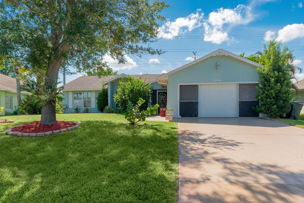 Photo of 2068 SW Driftwood Street, Port St Lucie, FL 34953 (MLS # R10920463)